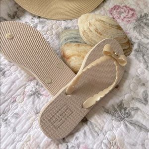 Kate Spade flip flops in light pink